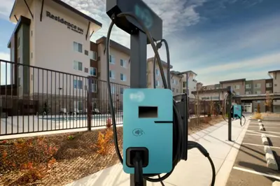 a charging station on a sidewalk next to a building at Residence Inn by Marriott Reno South in Reno