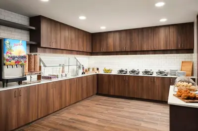 a large kitchen with wooden cabinets and a counter at Residence Inn by Marriott Reno South in Reno