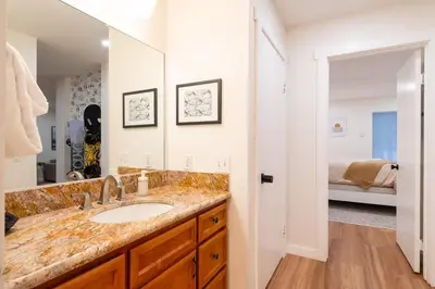 a bathroom with a sink and a mirror at Lux Retreat, Covered Parking, Walk to Golf in Mammoth Lakes