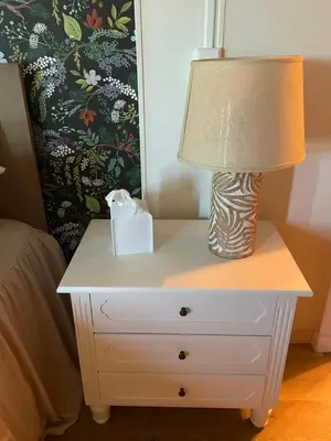 a lamp on a night stand next to a bed at Scenic Ranch Retreat Near Fresno in Fresno