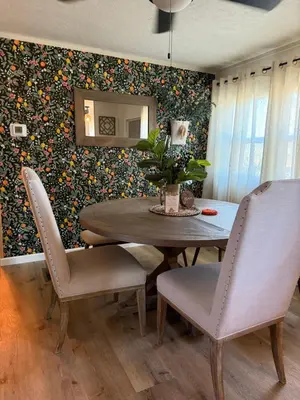 a dining room with a table and chairs and a mirror at Scenic Ranch Retreat Near Fresno in Fresno