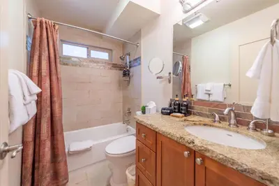 a bathroom with a sink and a toilet and a tub at Jester Court home in Tahoe Vista