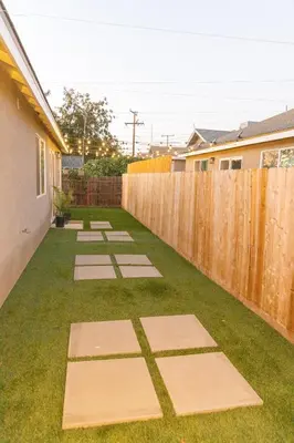 a backyard with stepping stones in the grass at Sequoia Oasis near Downtown Exeter in Exeter