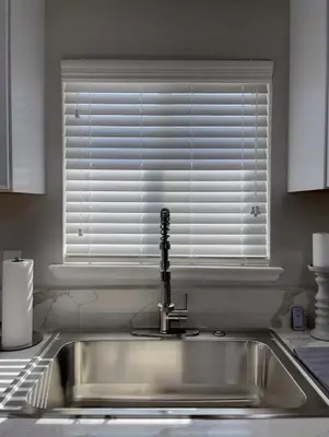 a kitchen sink with a window in a kitchen at Country Living 3BR with fenced yard on Mooney in Visalia