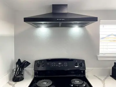 a black stove top oven in a kitchen at Cozy Entire Home Gateway to Sequoia Pet Friendly in Visalia