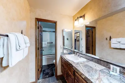 a bathroom with a sink and a mirror at Sierra Megeve 6 in Mammoth Lakes