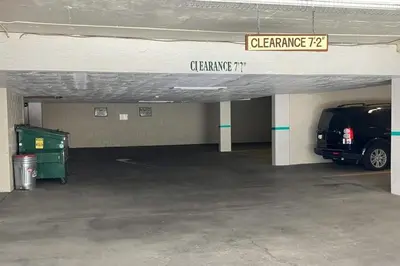a parking garage with a van parked in it at Sierra Megeve 6 in Mammoth Lakes