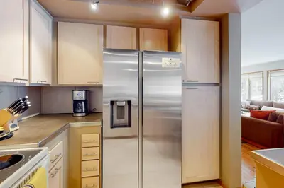 a kitchen with a stainless steel refrigerator in it at Sierra Megeve 11 in Mammoth Lakes