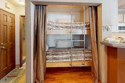 a walk in closet with bunk beds in it at Sierra Megeve 11 in Mammoth Lakes