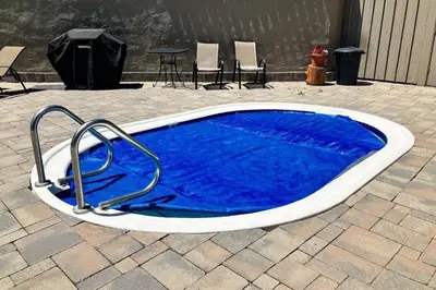 a pool with blue water in a patio at Sierra Megeve 11 in Mammoth Lakes