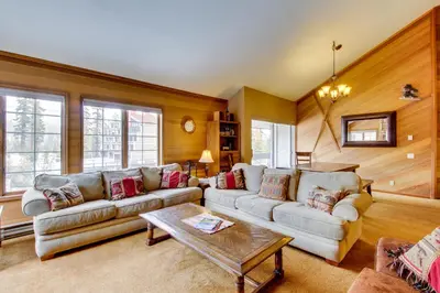a living room with two couches and a coffee table at Sierra Megeve 13 in Mammoth Lakes