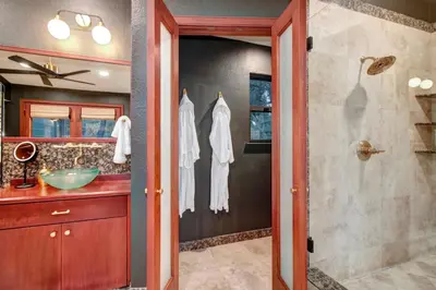 a bathroom with a shower and a sink at Elegant Granite Bay Getaway Tall Pine Home in Granite Bay