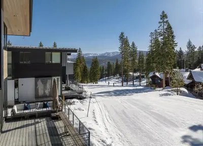 a house on a snow covered road with trees at Northstar Ski-In Ski-Out Luxury Townhome with Hot Tub in Truckee