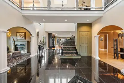 an open hallway with a staircase in a house at Vista De Lago Retreat Luxury Mansion with Pool and Theater in Granite Bay