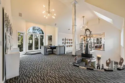 a living room filled with furniture and a large window at Vista De Lago Retreat Luxury Mansion with Pool and Theater in Granite Bay