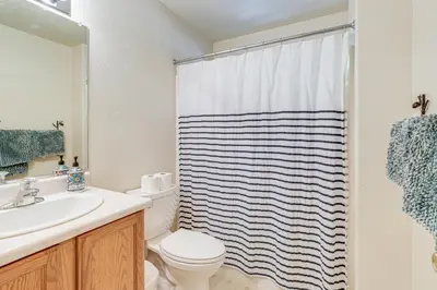 a bathroom with a sink and a toilet and a shower at Hike, Swim, Golf Family Retreat in Arnold! in Arnold