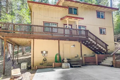 a house with a large deck on top of it at Hike, Swim, Golf Family Retreat in Arnold! in Arnold