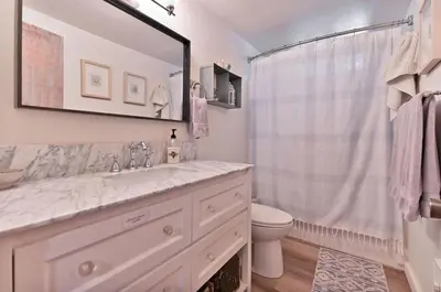 a bathroom with a sink and a toilet and a shower at Cozy Chic Chalet - Enchanting & Fun Family Retreat - Hot Tub & Fire Pit - Dog Friendly in Dorrington