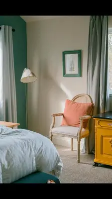 a bedroom with a bed and a chair and a lamp at Gorgeous 4BR Home Massive Modern Home in Cameron Park