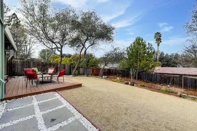 a patio with a table and chairs on a deck at Gorgeous 4BR Home Massive Modern Home in Cameron Park