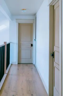 an empty hallway with a door and a wooden floor at Gorgeous 4BR Home Massive Modern Home in Cameron Park