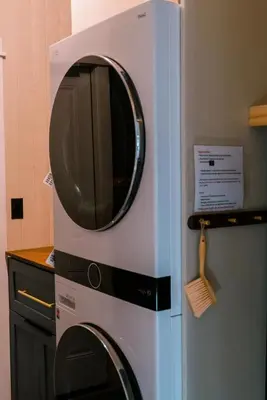 a microwave in a kitchen next to a refrigerator at Gorgeous 4BR Home Massive Modern Home in Cameron Park