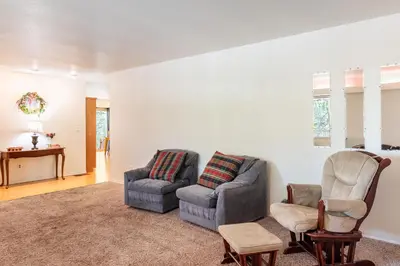 a living room with two chairs and a couch at Groveland 2BR Home - Mountain Retreat in Groveland