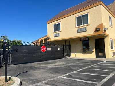 a stop sign in front of a building at Value Suites Extended Stay in Sacramento