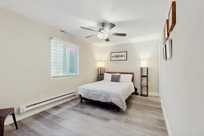 a bedroom with a bed and a ceiling fan at Sierra Solace in South Lake Tahoe