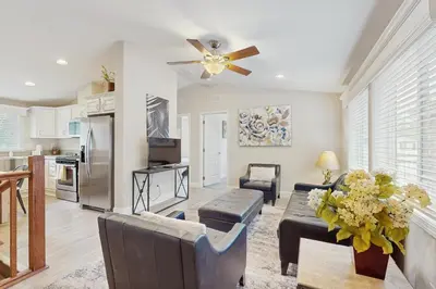 a living room with a couch and a ceiling fan at Sierra Solace in South Lake Tahoe