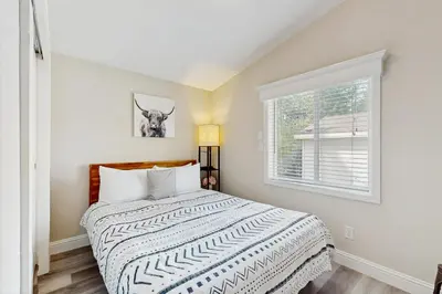 a bedroom with a bed and a window at Sierra Solace in South Lake Tahoe
