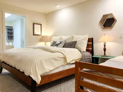 a bedroom with a large bed in a room at Enchanting Creekside Cabin Retreat near Yosemite National Park in California in Oakhurst