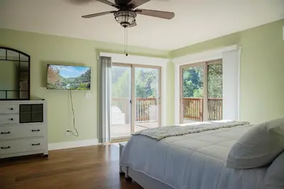 a bedroom with a bed and a ceiling fan at Buckeye Basecamp-Events-Family Friendly-Creek in Sonora