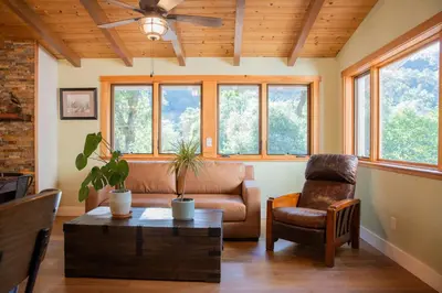 a living room with a couch and a chair at Buckeye Basecamp-Events-Family Friendly-Creek in Sonora