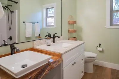 a white bathroom with a sink and a toilet at Buckeye Basecamp-Events-Family Friendly-Creek in Sonora