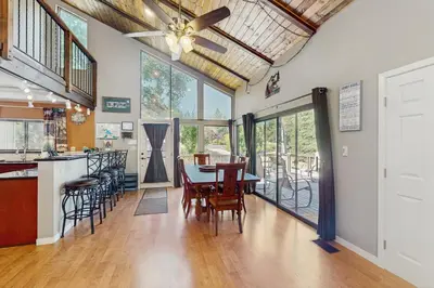 a kitchen and dining room with a table and chairs at Paradise Place in Groveland