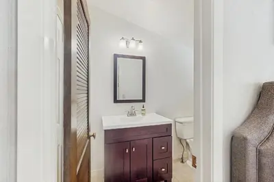 a bathroom with a sink and a mirror at Paradise Place in Groveland