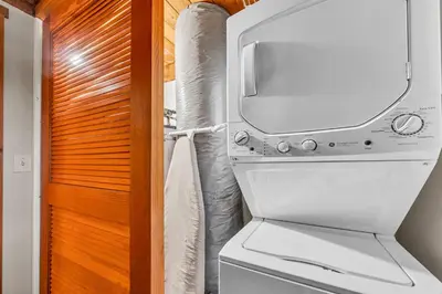a bathroom with a toilet and a television on top of it at Peaceful Getaway Pet Friendly with Hot Tub and Grill in Tahoe City