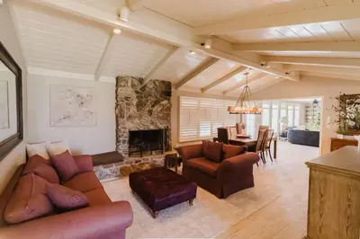 a living room with a couch and a fireplace at Villa Luxury Family Getaway in Patterson