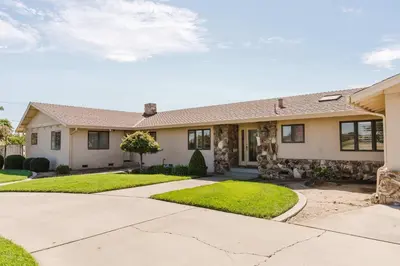 a house with a driveway and grass at Villa Luxury Family Getaway in Patterson