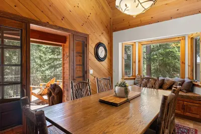a dining room with a wooden table in a house at Luxury 4BR Retreat Near Northstar Sleeps 10 in Tahoe Vista