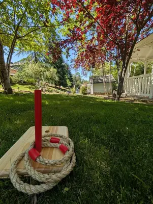 a red candle in the grass in a yard at The Blue Resort of Yosemite - Pool, Spa, Games in Mariposa