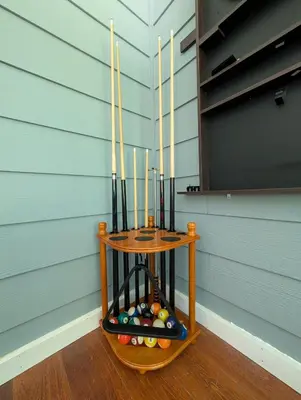 a wooden stand with baseball bats and balls at The Blue Resort of Yosemite - Pool, Spa, Games in Mariposa