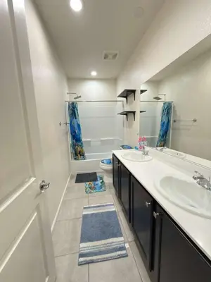 a white bathroom with two sinks and a tub at Peaceful Private Room in Sparks in Sparks