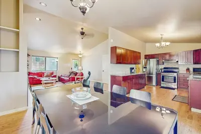 a kitchen and living room with a table at My Tahoe Sanctuary in South Lake Tahoe