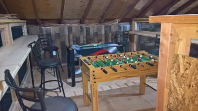 a room with a table with a chess board at Mountain Top Barn retreat with View in Bodfish