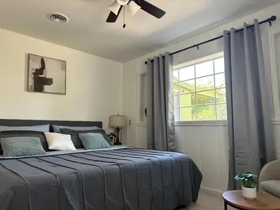 a bedroom with a bed and a window at Suite E with 2-bedroom in Sacramento