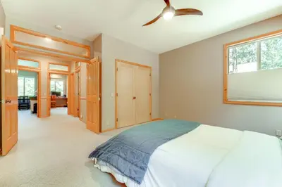a bedroom with a bed and a ceiling fan at Near Ski Resorts and Trails Truckee Home with Hot Tub in Truckee
