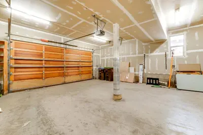 a garage with wooden doors in a room at Near Ski Resorts and Trails Truckee Home with Hot Tub in Truckee
