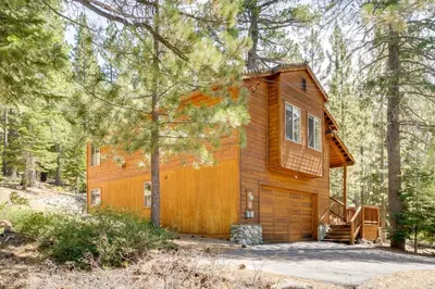 a cabin in the woods with a tree at Near Ski Resorts and Trails Truckee Home with Hot Tub in Truckee